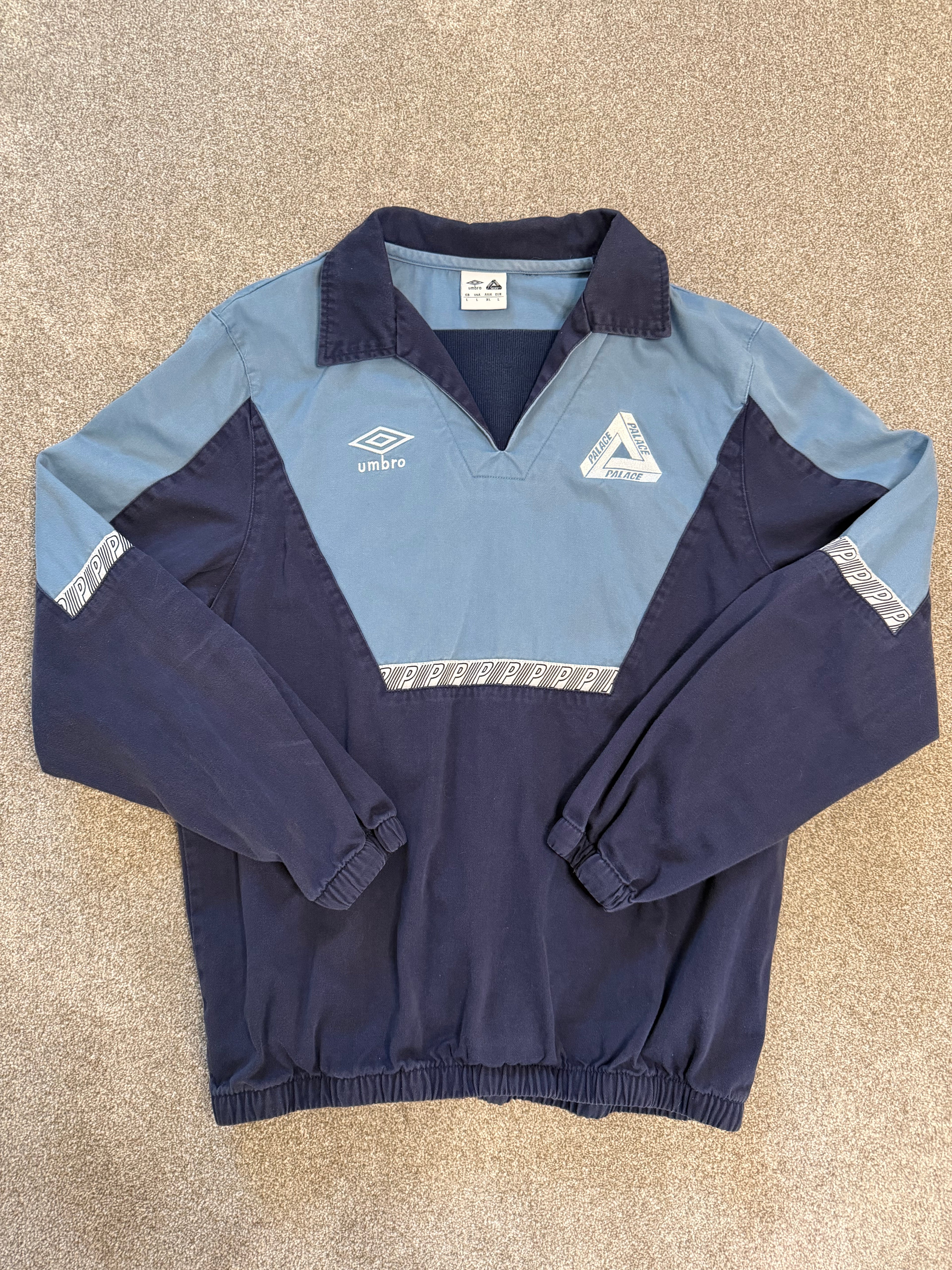Palace x Umbro drill top